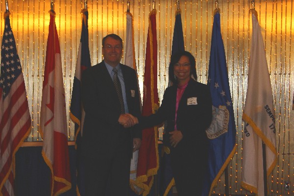 Col. Jenkins-Harden (l) thanks Winchester for his presentation in April. 
